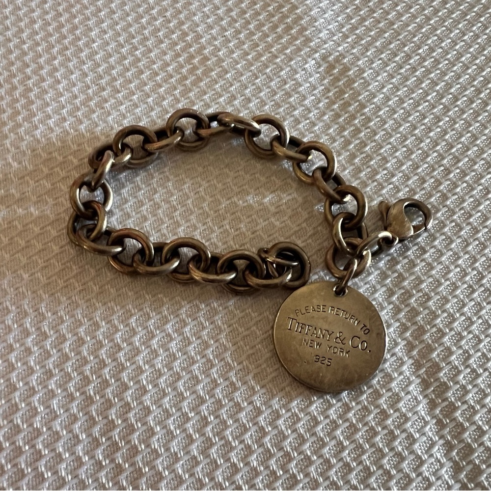 Tiffany&Co. Silver Bracelet with Round Charm with oval shaped matching necklace.